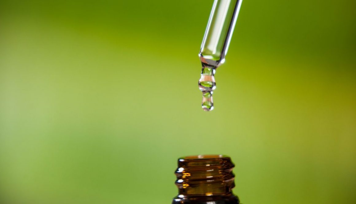 drop-of-oil-dripping-from-pipette-into-bottle-of-essential-oil (2)